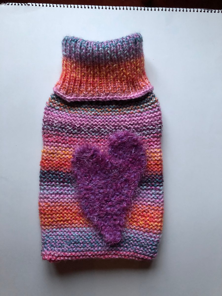 Hand knitted hot water bottle cover