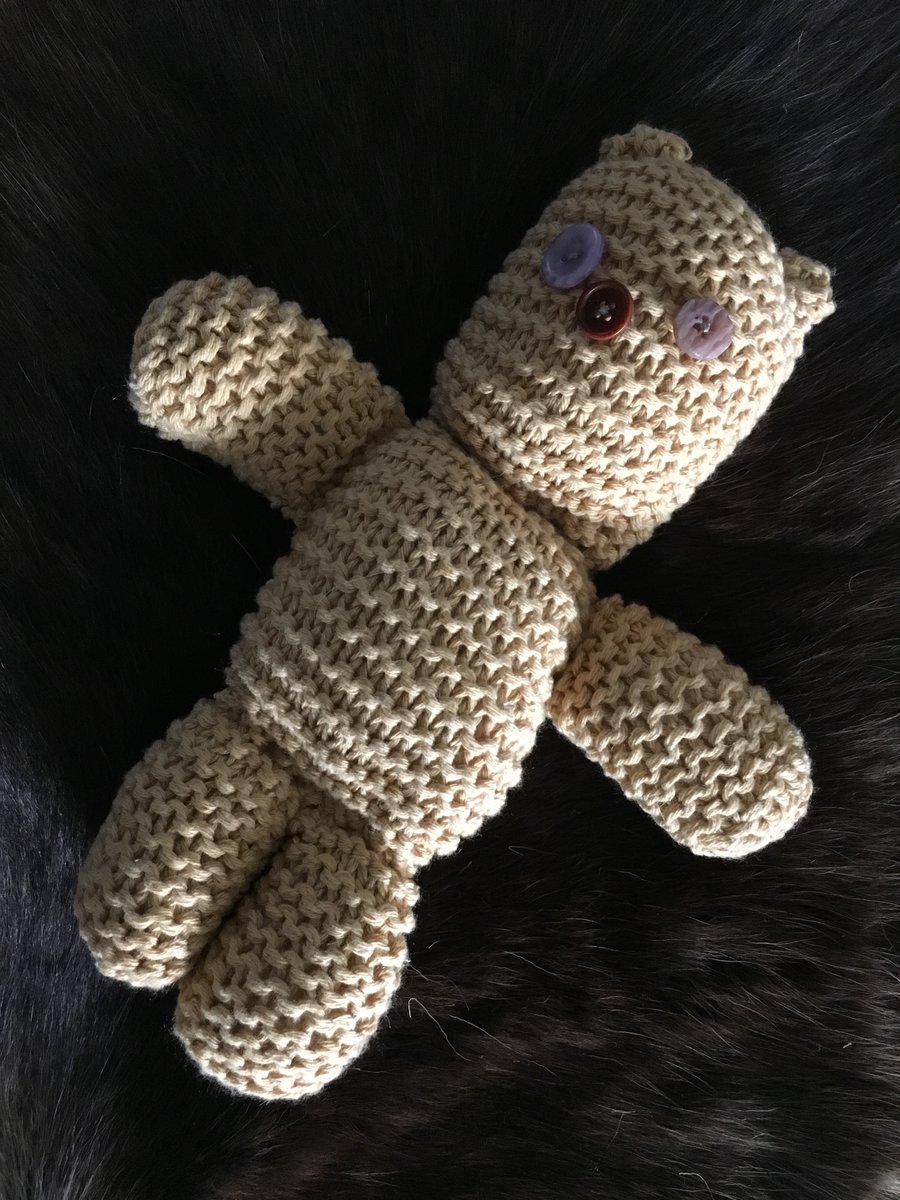 Hand knitted button-eye teddy bear