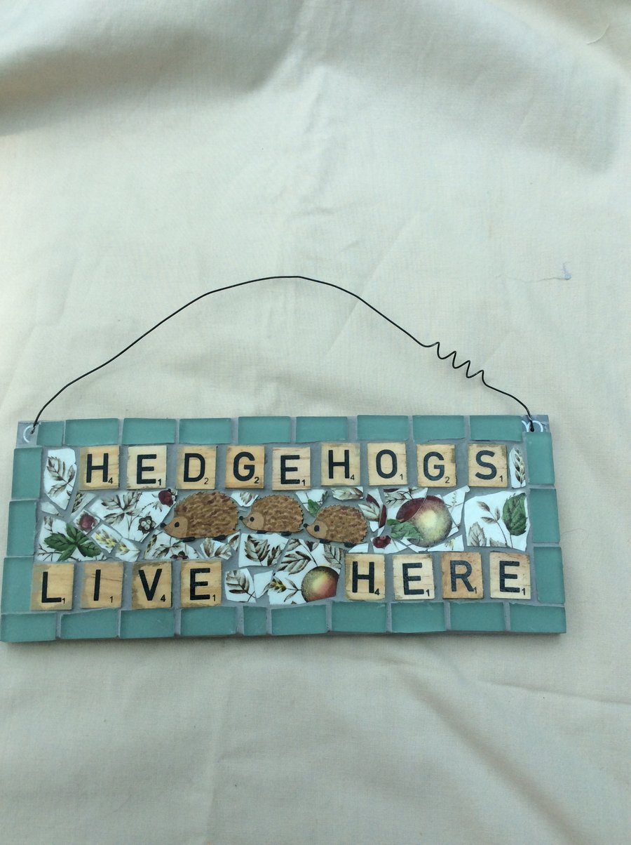 Hedgehogs live here mosaic sign