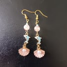 Gold, pastel blue and pink dolphin and shell charm beaded dangle earrings 