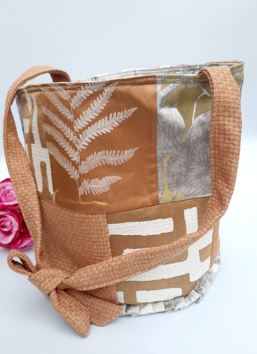 Burnt gold patchwork bucket bag.