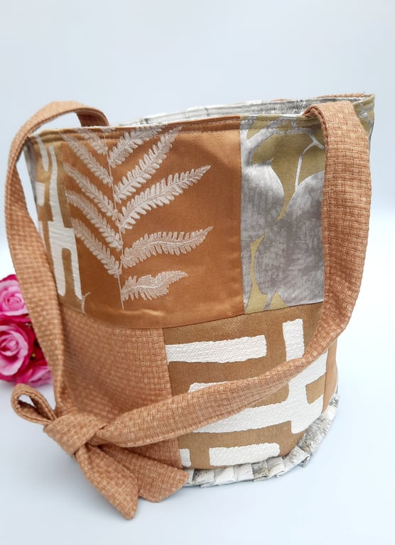 Burnt gold patchwork bucket bag.