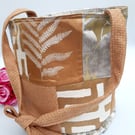 Burnt gold patchwork bucket bag.