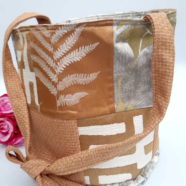 Burnt gold patchwork bucket bag.