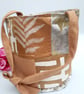 Burnt gold patchwork bucket bag.