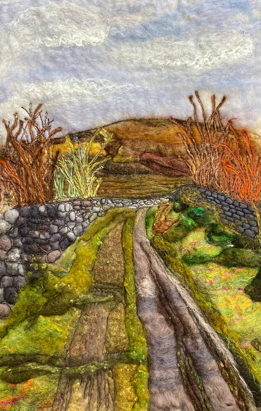 Mixed media country lane landscape with moorland in the distance. 