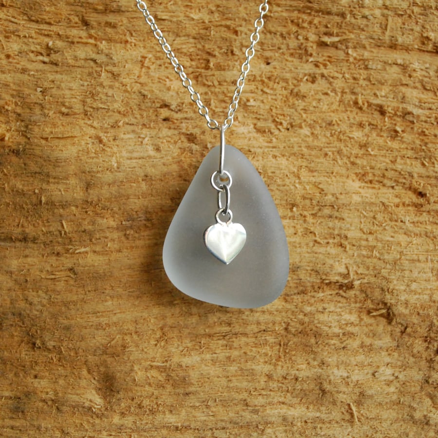Grey beach glass pendant with silver heart