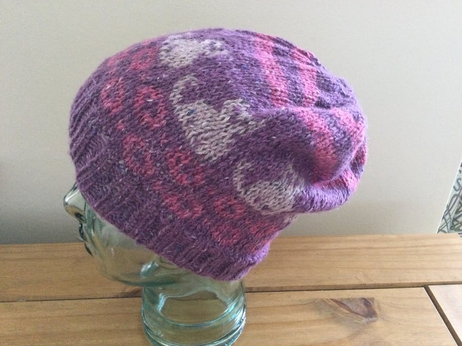 A woman’s cute hand knitted Cat Lover’s hat in purple and pink, new.