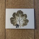 Cabin. Image made on a printing press and a hand made stamp.