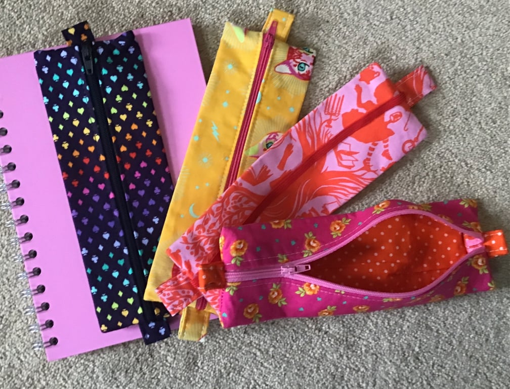 Pouch with Zip. Pencil case has elastic, which means it can be attached to noteb