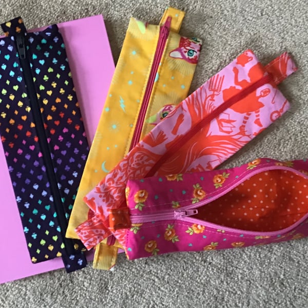 Pouch with Zip. Pencil case has elastic, which means it can fix to a book