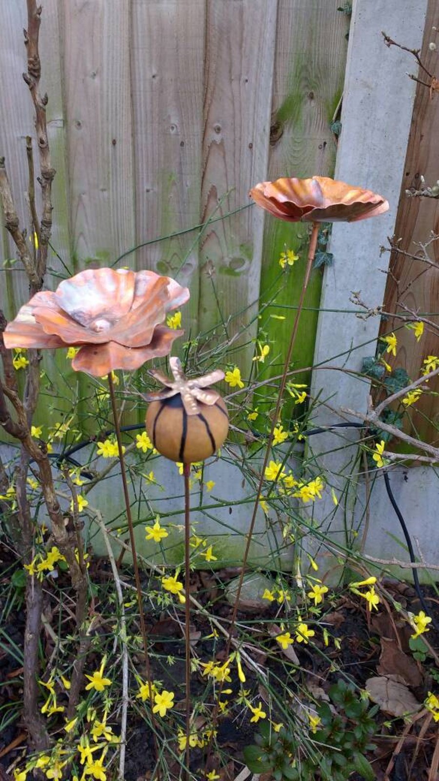 Copper poppy garden stakes