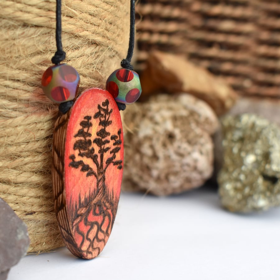Pyrography bonsai tree silhouette, with a sunset. Wooden oval pendant.