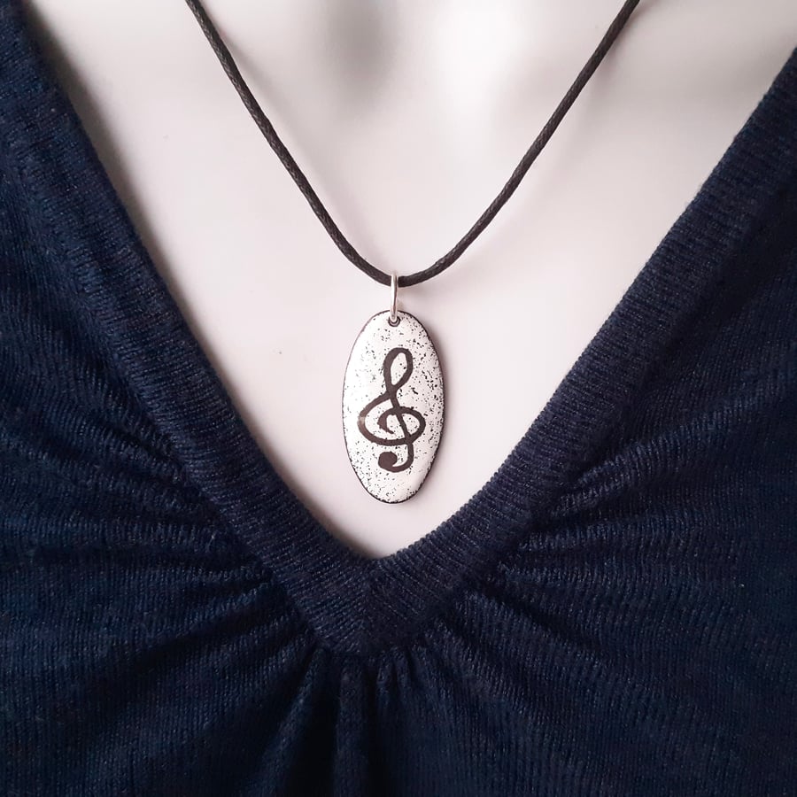 Oval Music Pendant - Treble Clef