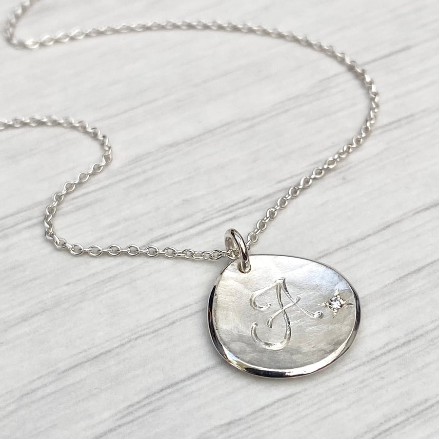 Handmade solid silver 16mm diamond petal charm pendant on a trace chain