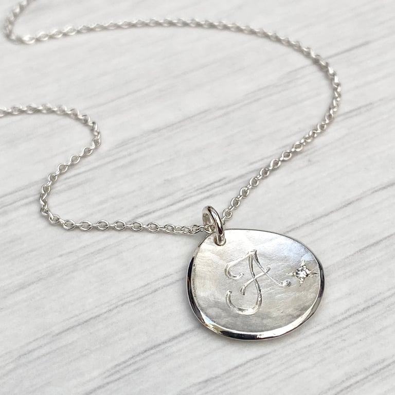 Handmade solid silver 16mm diamond petal charm pendant on a trace chain