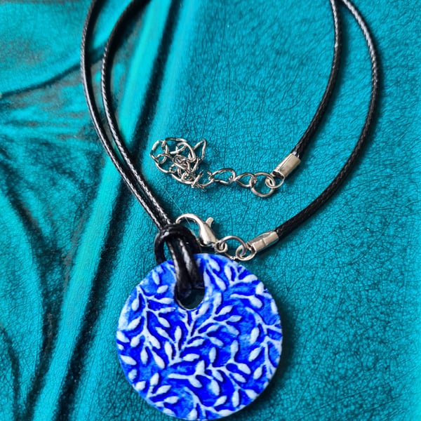 Clay round embossed ivy leaf blue necklace pendant