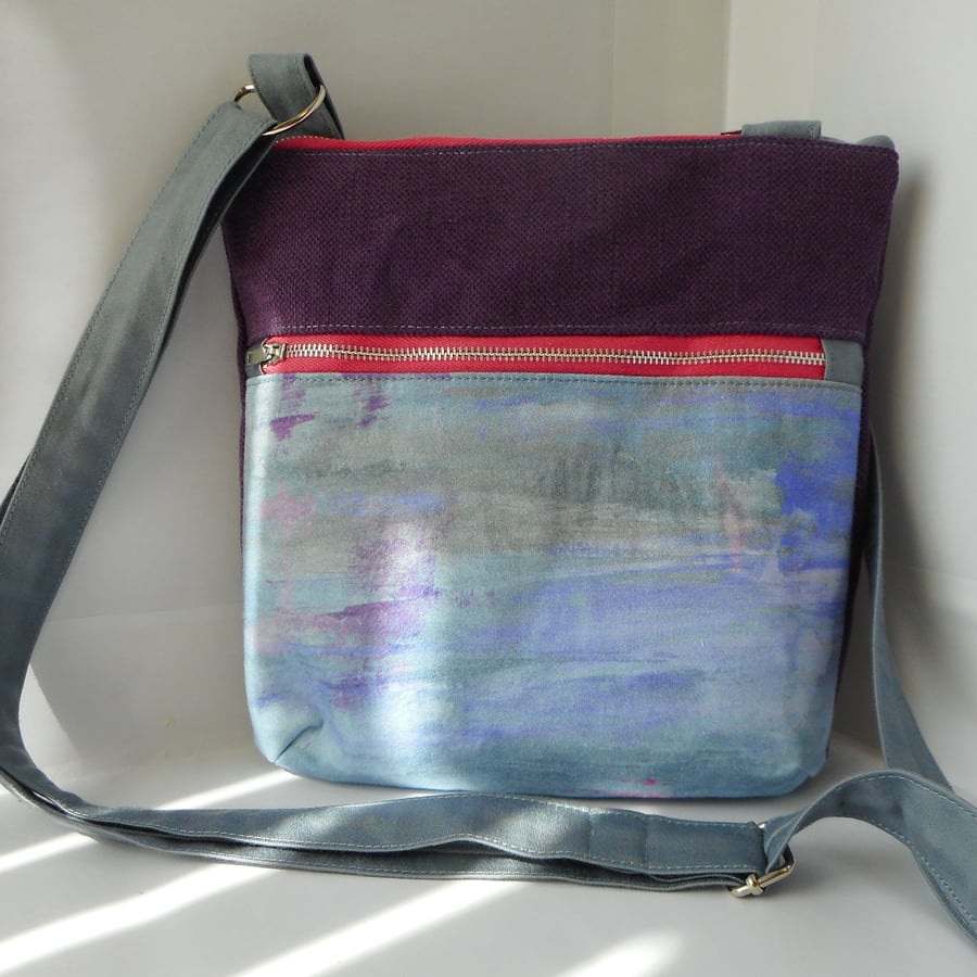 Sold. Taliesin fabric crossbody bag with zipped pocket on front