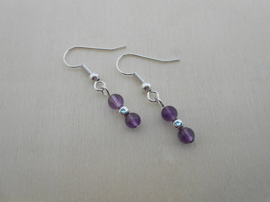 African amethyst drop earrings in silver plate.