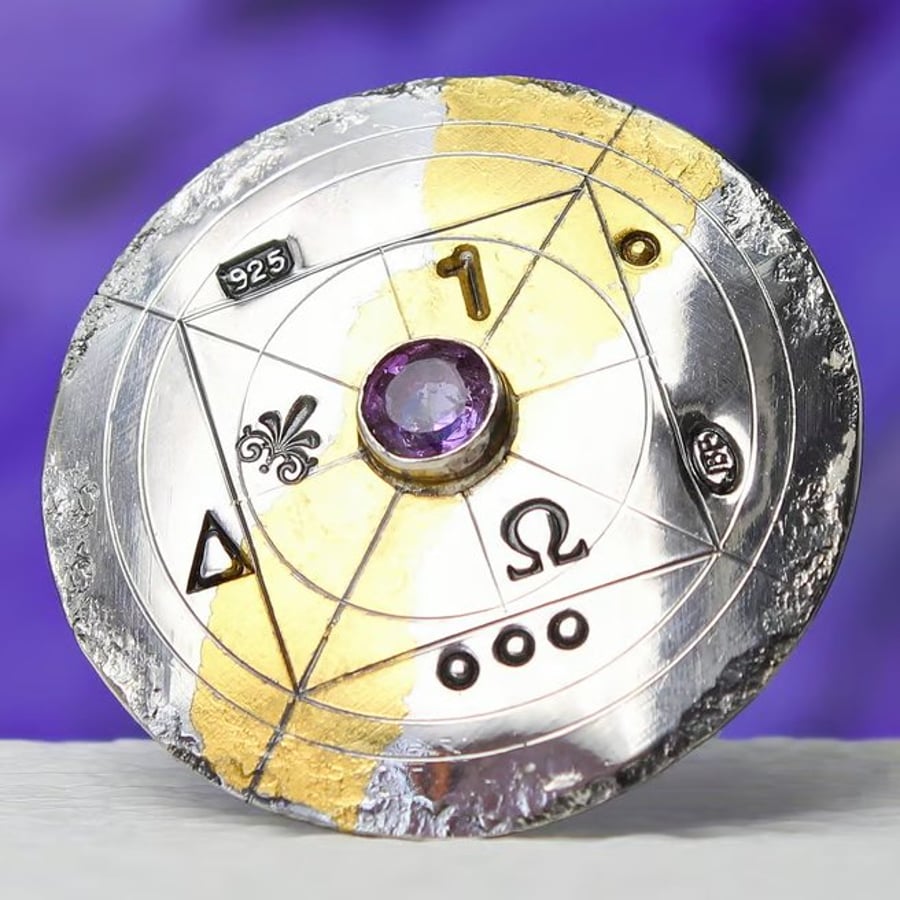 Image of Handmade gold and silver brooch with a beautiful, light purple, faceted gemstone