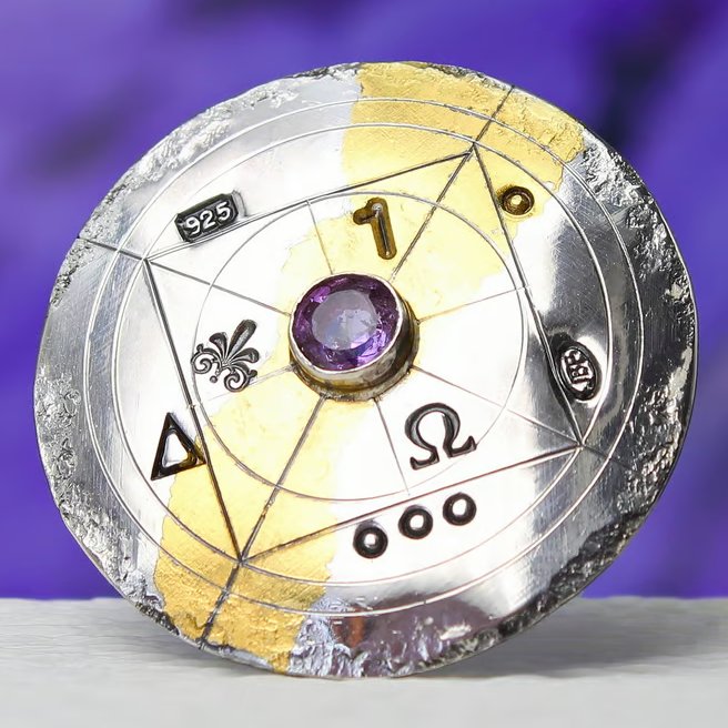 Handmade gold and silver brooch with a beautiful, light purple, faceted gemstone