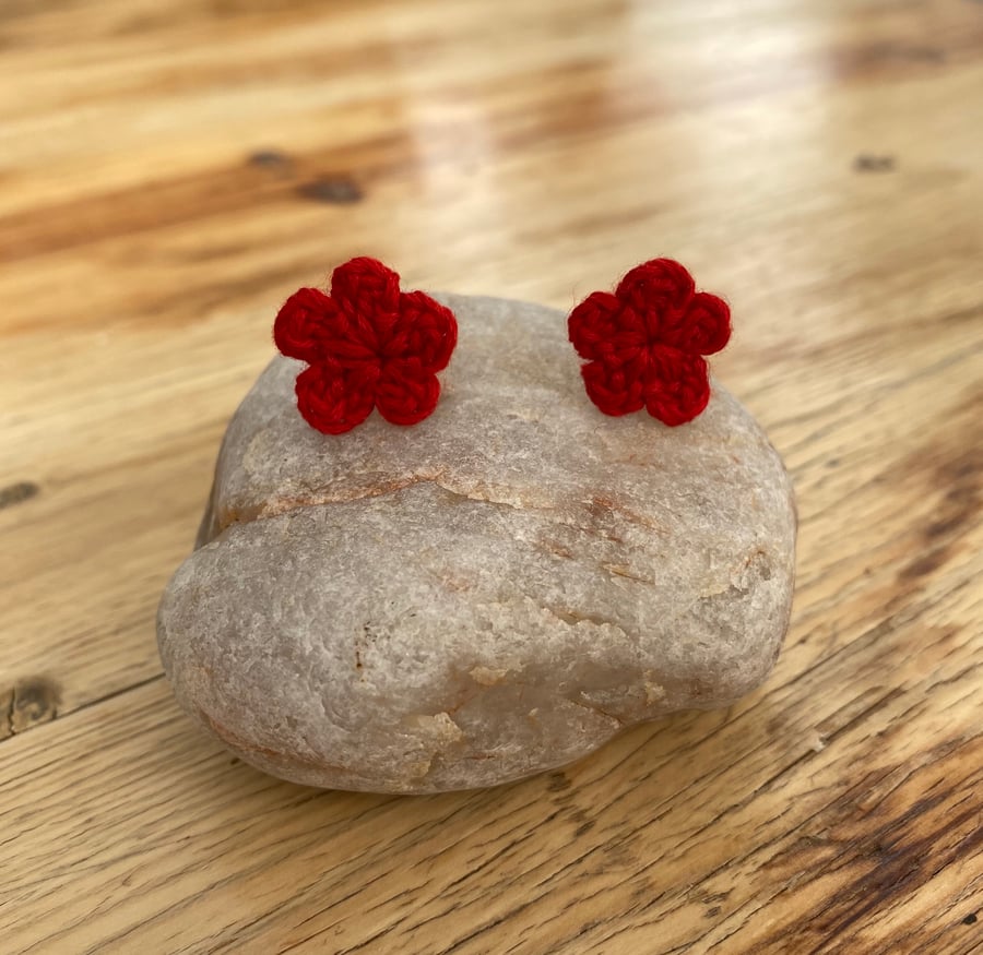 Red flower earrings on hypoallergenic surgical steel studs