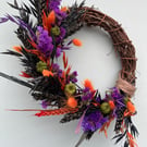 Small dried flower Halloween wreath with pumpkins 