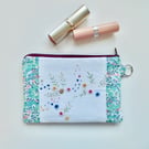 Make up bag in reclaimed embroidered cloth with Liberty trim and denim