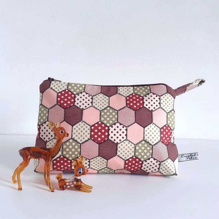 Make up or toiletries bag in a vintage patchwork print design.