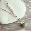Silver pendant with peridot  raw cystal charm.
