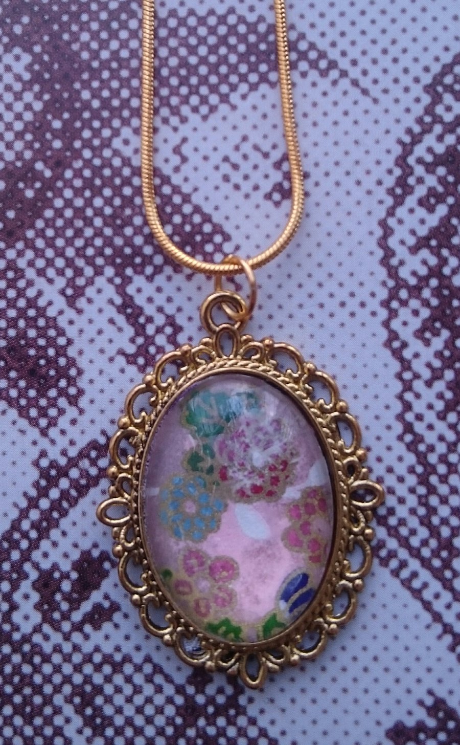 Delicate Oval Pendant with Japanese Design