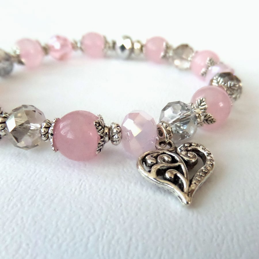 Pink stretchy bracelet, with pink gemstone, crystal & heart charm