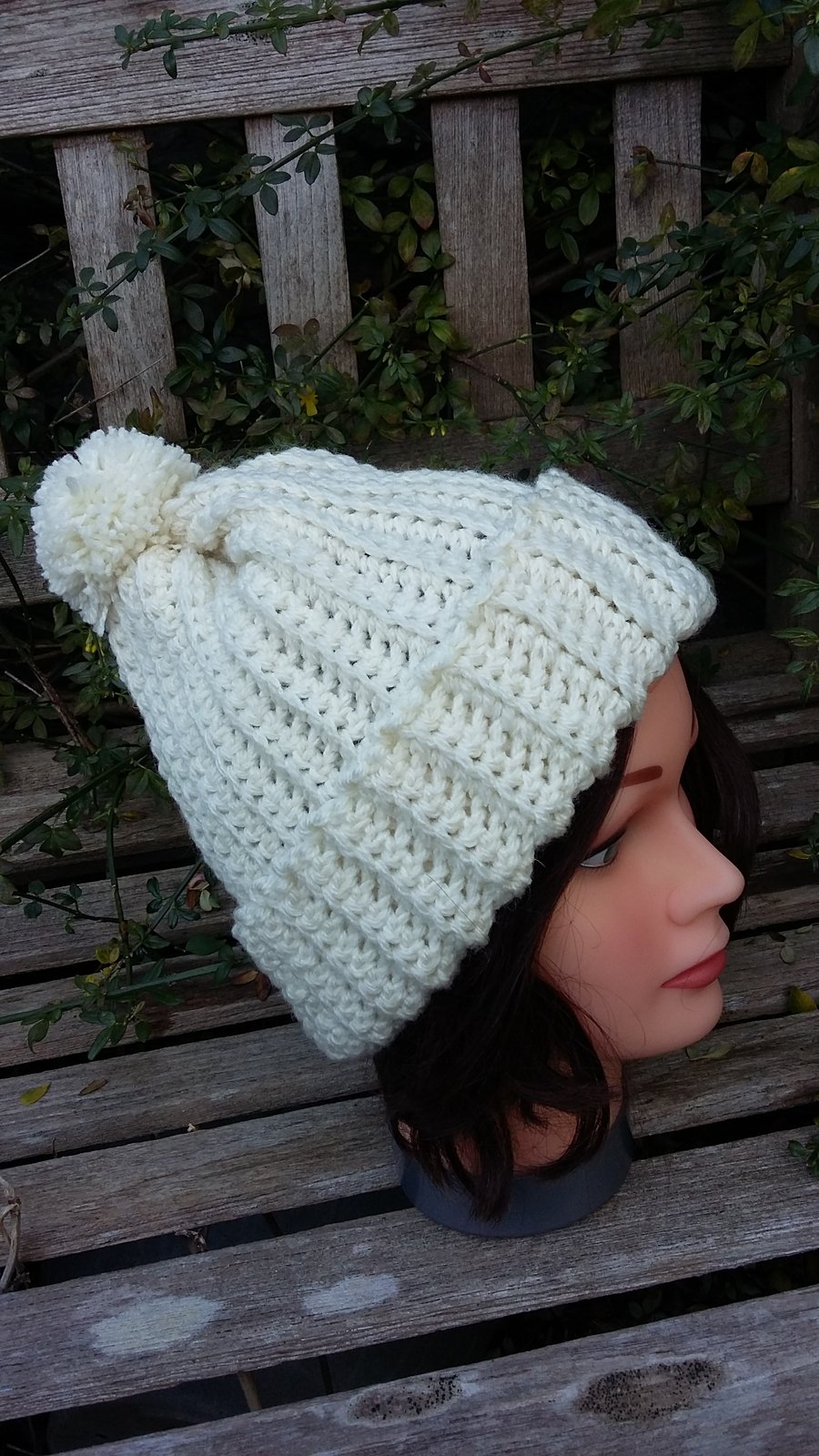 Crochet rib effect bobble hat in cream. 