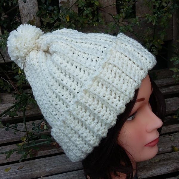 Crochet rib effect bobble hat in cream. 