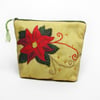 Make up bag with poinsettia design on the front with hand embroidered highlights
