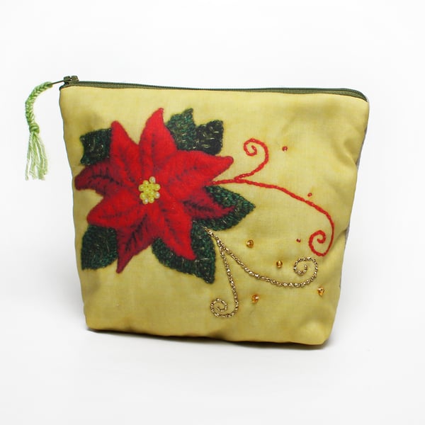 Make up bag with poinsettia design on the front with hand embroidered highlights