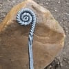Ammonite style fire poker handcrafted in a blacksmiths forge