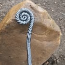 Ammonite style fire poker handcrafted in a blacksmiths forge