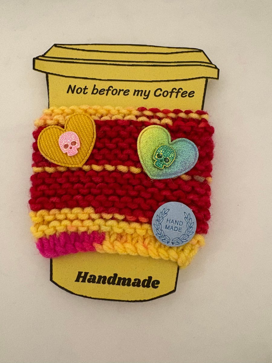 Skull in hearts knitted cup cosy. 