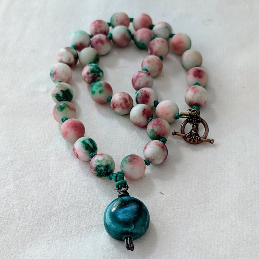 White, burgundy and green jade knotted cord necklace with ceramic pendant 