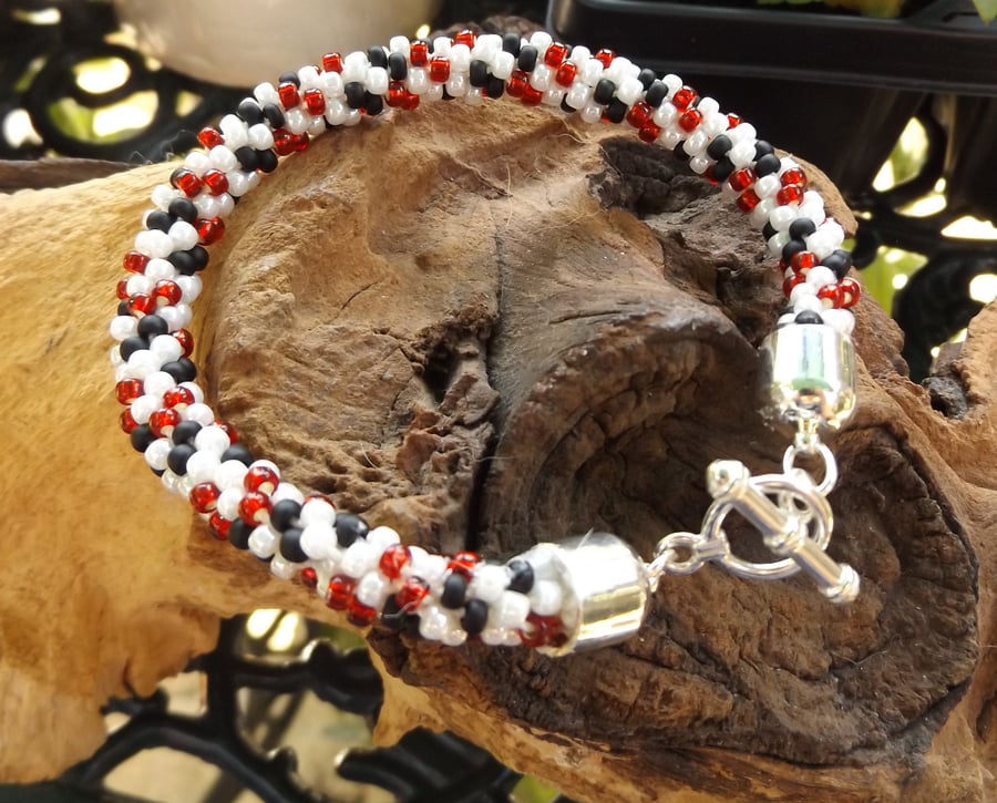 Kumihimo seed beaded black white and red bracelet