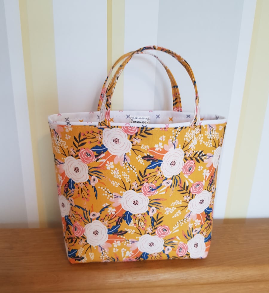 Reusable fabric gift bag; floral design on yellow