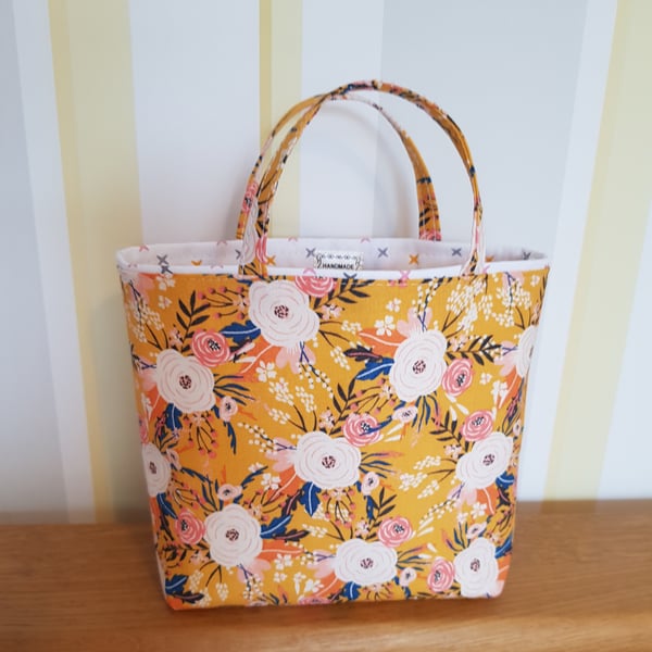Reusable fabric gift bag; floral design on yellow