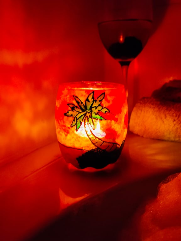 Painted glass candle holder for tea light with sunset over palm tree island