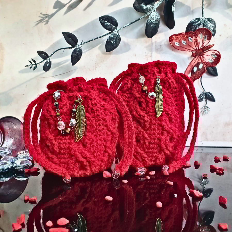 Drawstring pouch with a cable design, medium size with beads & a feather charm