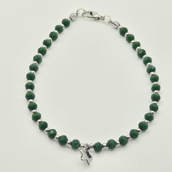 Green glass beaded bracelet with small silver star charm
