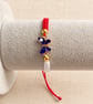 Red and White Macramé Bracelet with Blue Butterfly – Adjustable - Image 2