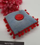Pin cushion in denim with red bobble trim.  - Image 1