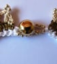 A crocheted necklace in white, coffee and cream cotton with edging of gold beads - Image 5