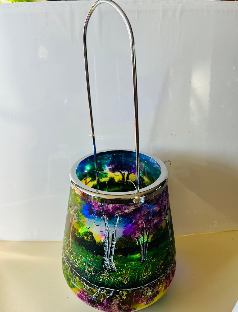 A hand painted and fired glass and metal lantern by Andrew Jenkins 